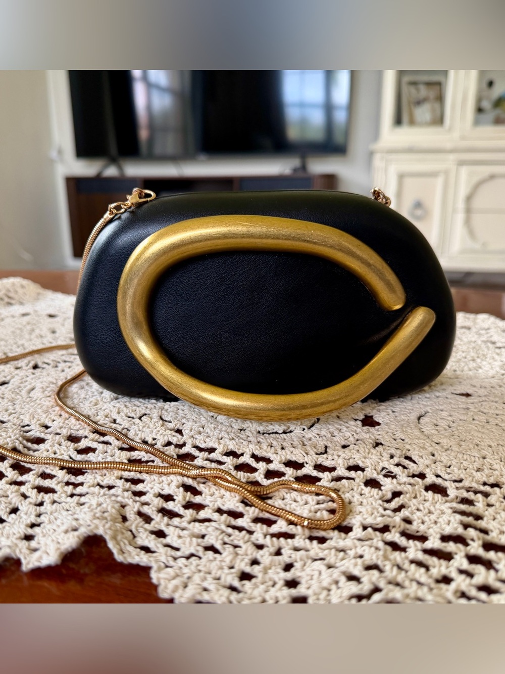 Black Leather Crossbody Clutch with Gold Accent - Picture 2 of 6